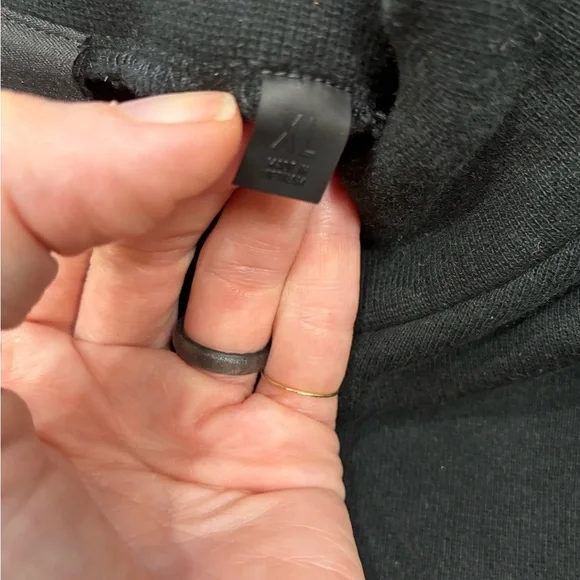 This is a Fear of God Essentials black sweatshirt. - Picture 6 of 7